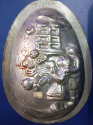 Easter mold used for chocolate egg with children and gifts design