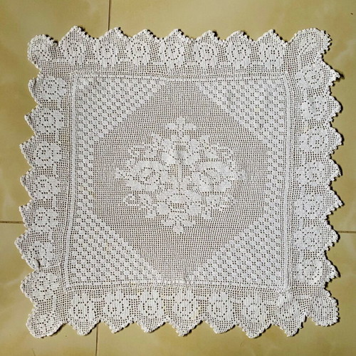 Handmade knitted square used with cotton thread