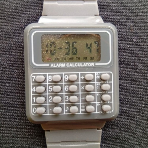 Digital watch with calculator used, unisex, gray