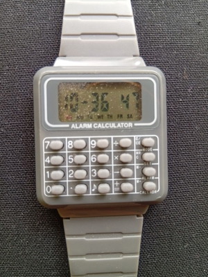 Digital watch with calculator used, unisex, gray