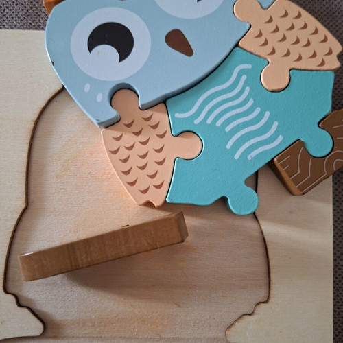 Wooden puzzles for children used, owl and elephant