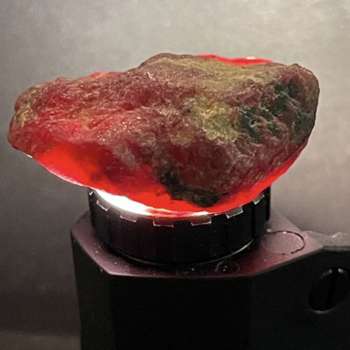 Raw large ruby 109ct in airtight display case