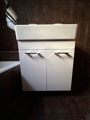 Bathroom cabinet used with soft close doors