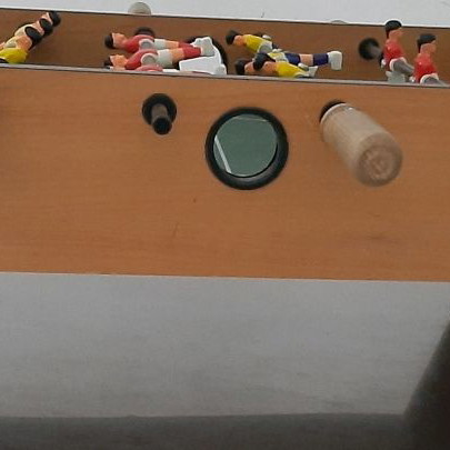 Wooden tabletop foosball used with wooden handles and 2 balls