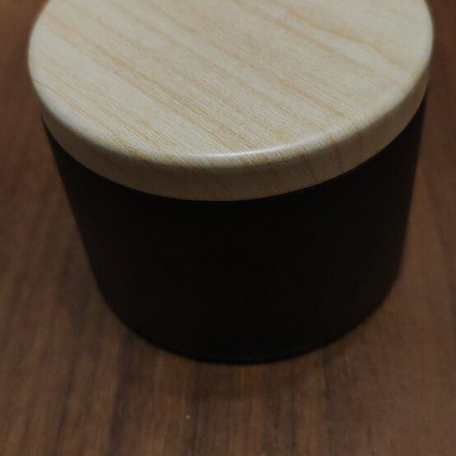 Wax melts in black matte metal container with choice of scent