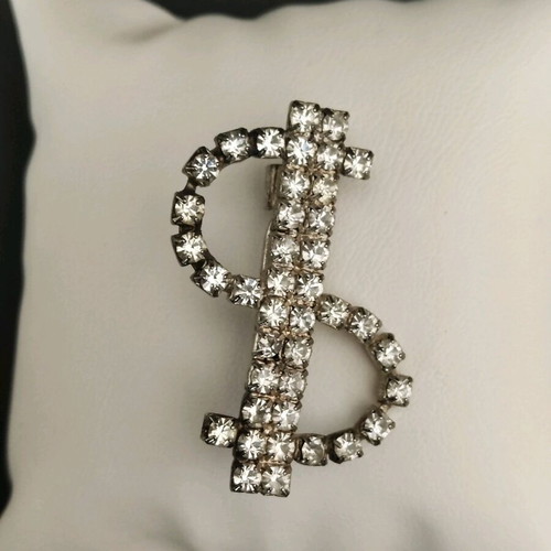 Dollar brooch like new with stones