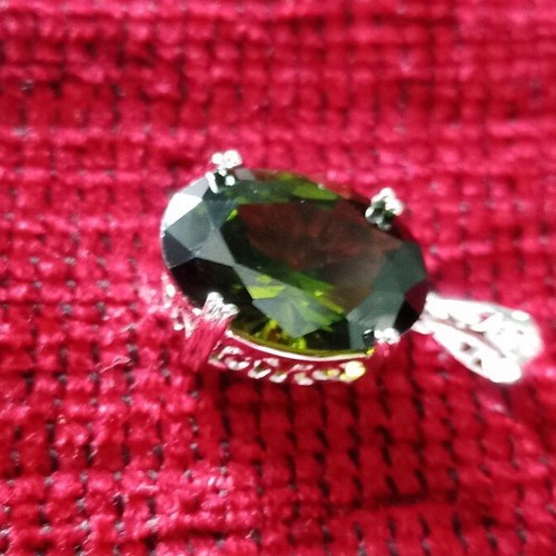 Pendant with green lab topaz in silver-plated base like new