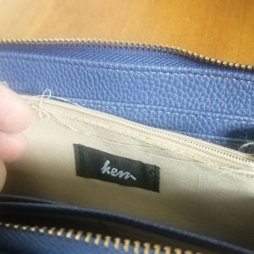 KEM wallet used, blue with multiple compartments