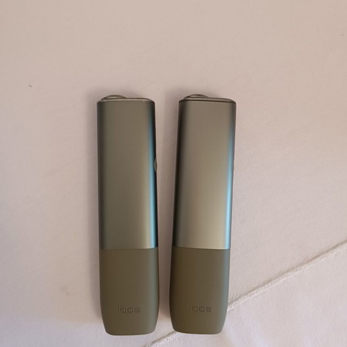 Iqos devices used, pack of two green with charger and brush