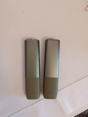 Iqos devices used, pack of two green with charger and brush