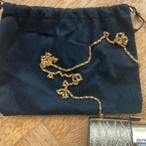 Gold clutch bag with chain strap