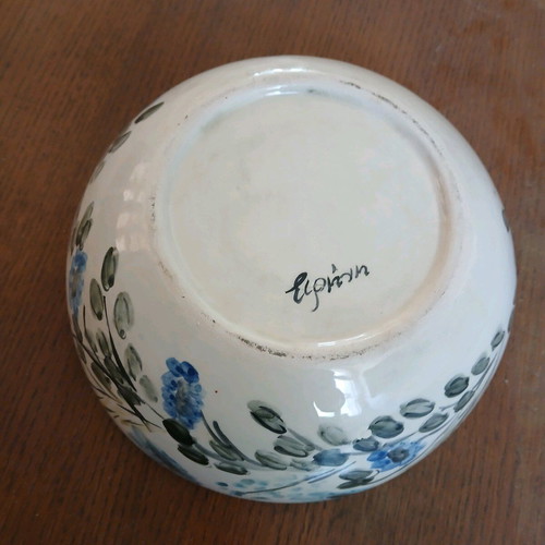 Hand-painted clay bowl like new with floral design