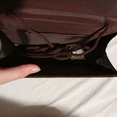 Official hand bag like new in brown shades with sequins