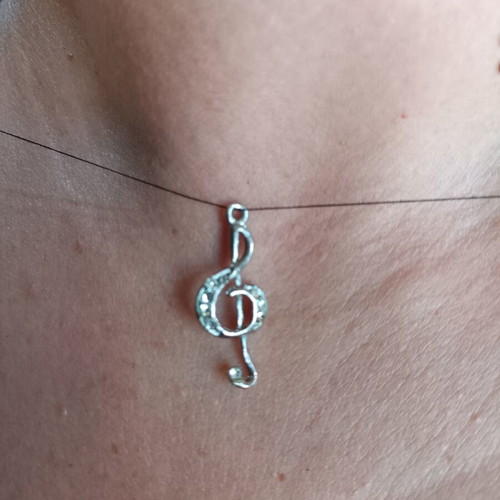 Silver Treble Clef Pendant like new with sparkling rhinestones