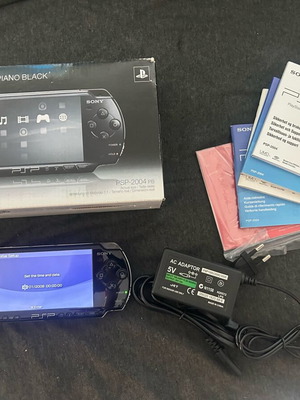Sony PlayStation Portable PSP 2004 μεταχειρισμένο με φορτιστή και μπαταρία after market