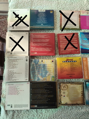 Collection of 22 Greek and international music CDs in 13 cases