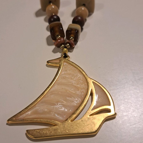Necklace like new with multicolored beads and gold sailboat pendant