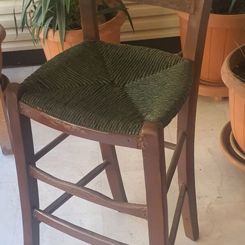 Wooden high chair with woven seat