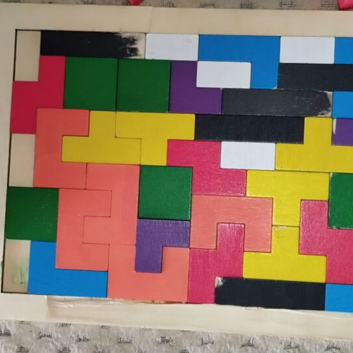 Wooden and magnetic toys used, including plastic mini tic-tac-toe and balls
