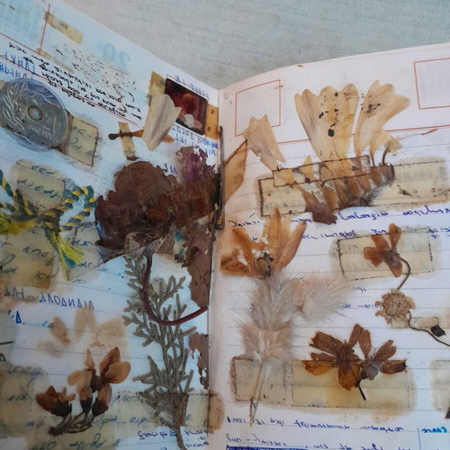 Old 1960 calendar used with dried leaves and flowers