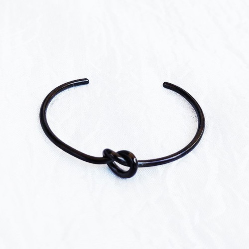 Tumi stainless steel knot bracelet black, like new