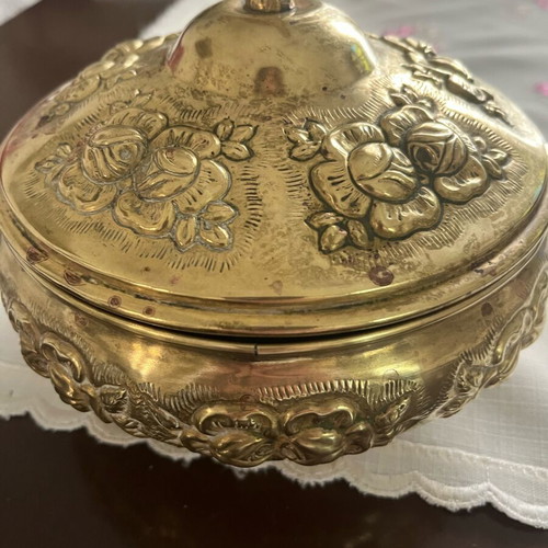 Vintage brass jewelry box used with embossed floral motifs