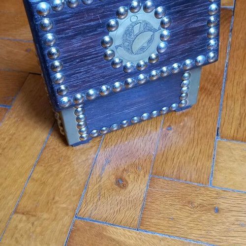 Decorative small wooden chest used with metal details