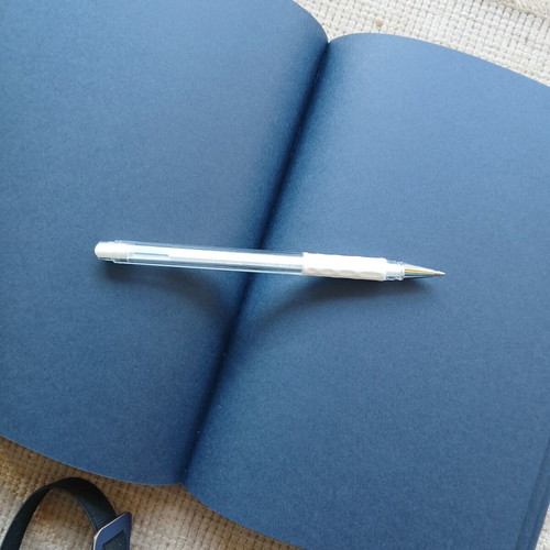 Sketchbook with dark pages and white pen new