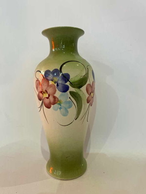 Vintage decorative ceramic vase with painted flowers used