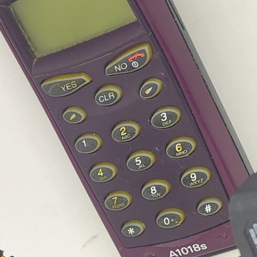Ericsson A1018s mobile phone like new, plum color, original charger