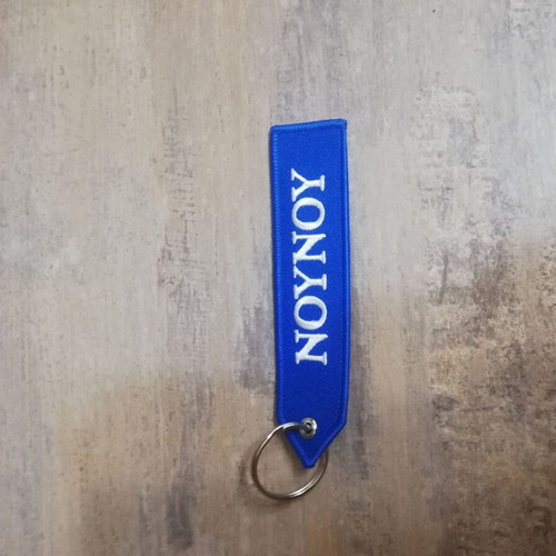 Nounou keychain new, blue with white letters