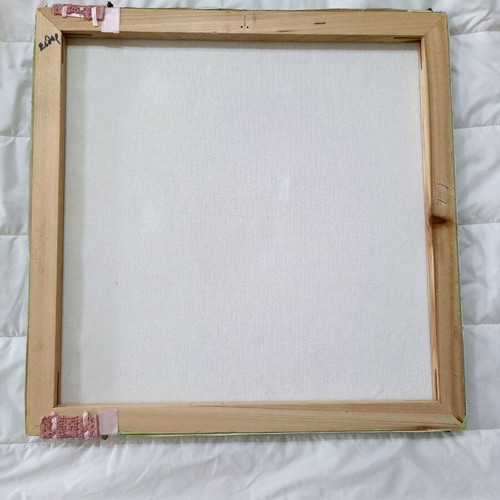 Handmade canvas frame with baby romper, pink flowers, beads, and lace