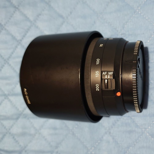 Sony A500 camera used with two lenses, battery, SD card, and carrying case