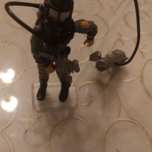 G.I. Joe action figure with weapons