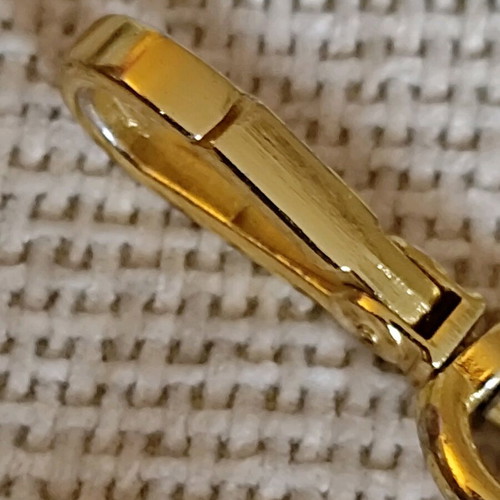 Authentic Prada gold key ring unisex like new