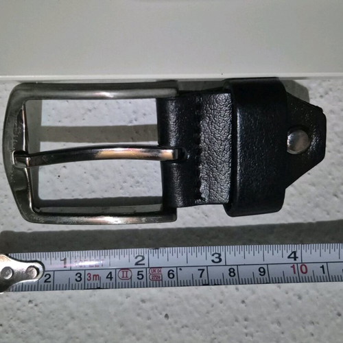 Simple metal belt buckle with prong and leather loop like new
