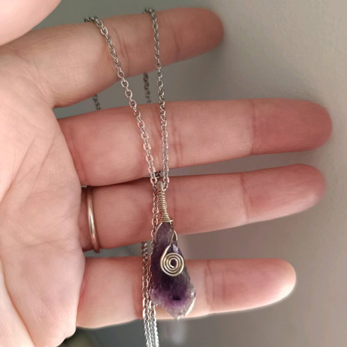 Amethyst wire-wrapped pendant on steel chain