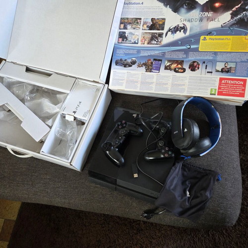 Sony PlayStation 4 500GB console used with 2 controllers, headset, USB hub, and 3 games