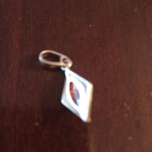 Silver pendant with amber new