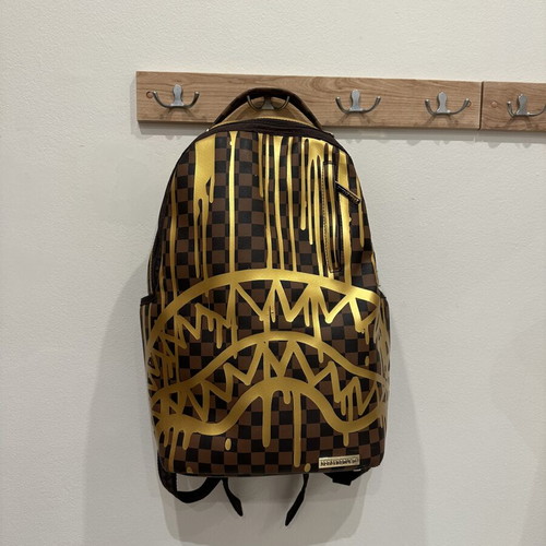 Sprayground That Gold Drip DLXSV Backpack new, black and brown checkered with gold design