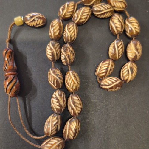 Komboloi carved bone, new, 23 beads 11×16mm