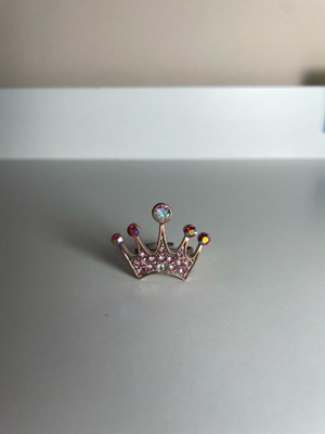 Crown ring used, pink, with wear and repair needed