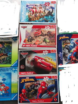 Puzzle set like new, 7 puzzles of 100 pieces each