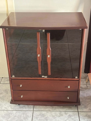 Wooden showcase with glass doors and drawers used