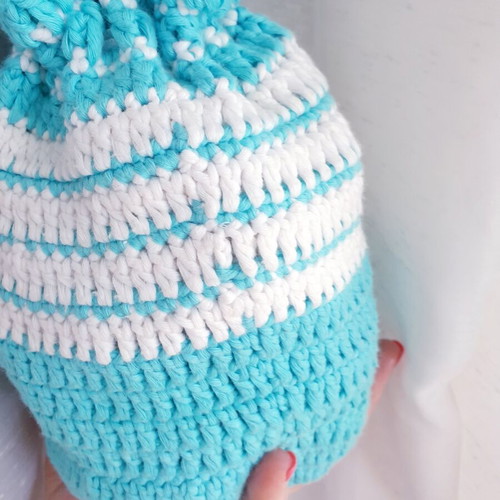 Handmade turquoise knitted pouch toiletry bag used