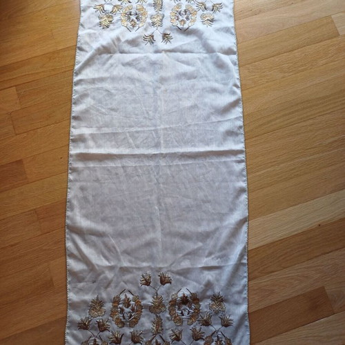 Embroidered table runner used with gold thread and lace