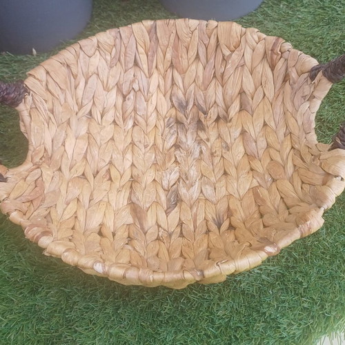 Wicker basket with black handles used