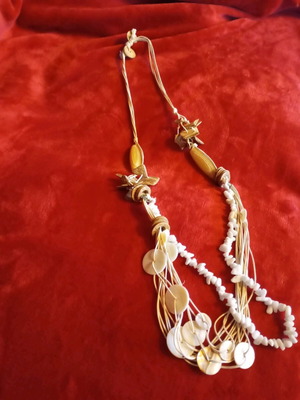 Summer necklace with white coral, cords and shell details