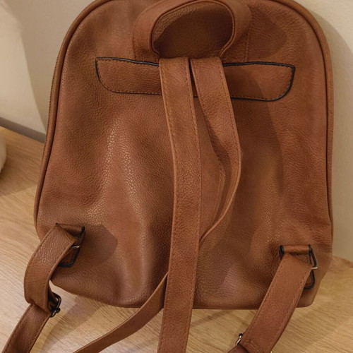 Brown backpack like new with leather texture and two compartments