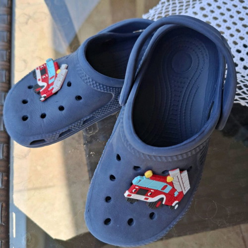 Kids Cros slippers size 25 like new, blue with fire truck figure